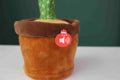 green background, gray ground, brown fabric flowerpot, red play button, dancing cactus, voice-activated smart singing talking dancing cactus toy, zoomed product image, toddler and baby toys, product image