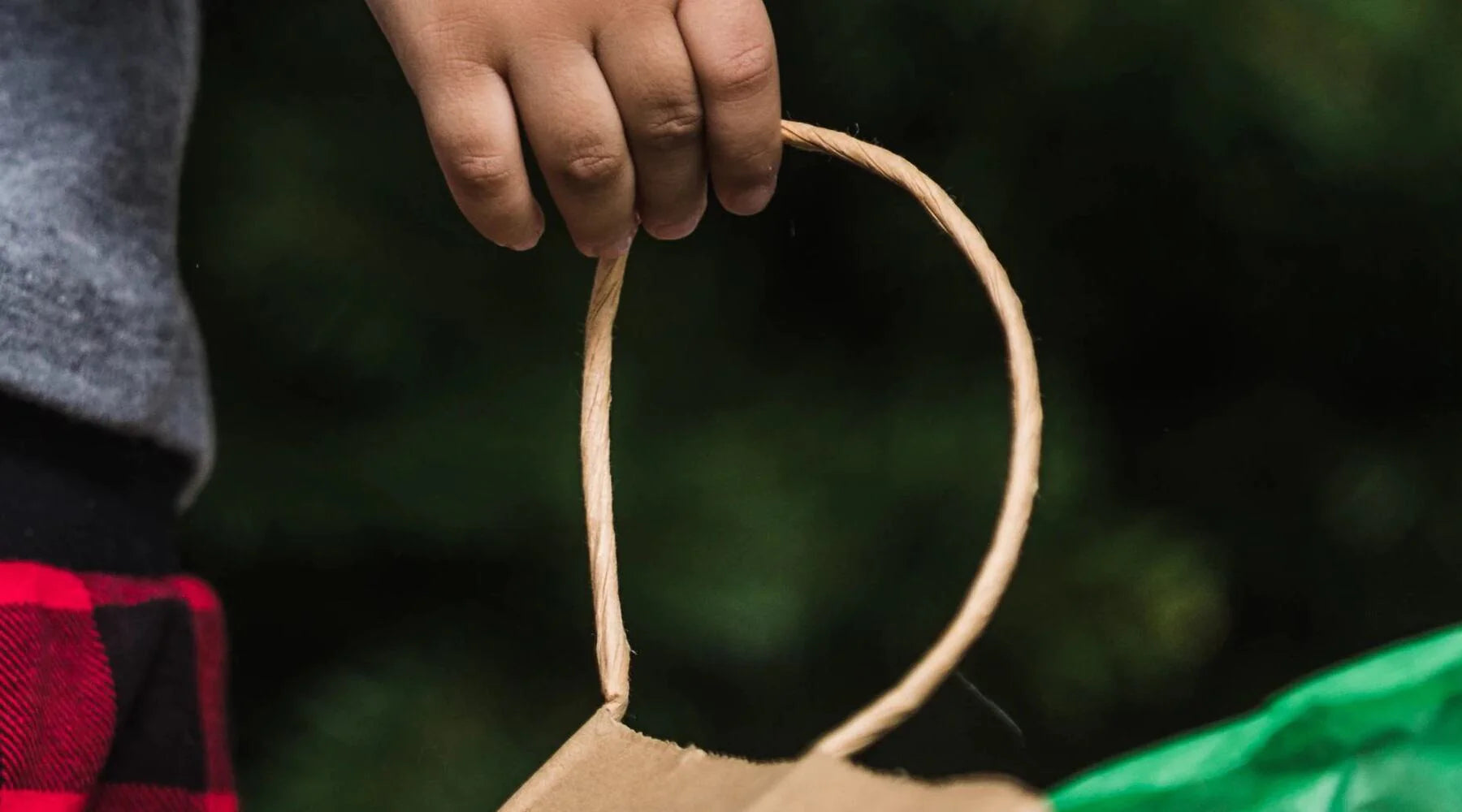 kid-holding-shopping-bag-green-leafs-paper-bag-lumberjack-pants-package-includes-dancing-cactus-toy